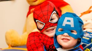 children dressed super heroes